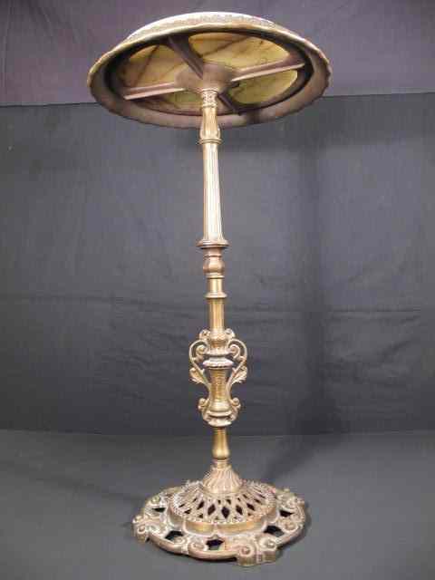 Appraisal: Cast brass marble pedestal table Circa Marble removable top Condition