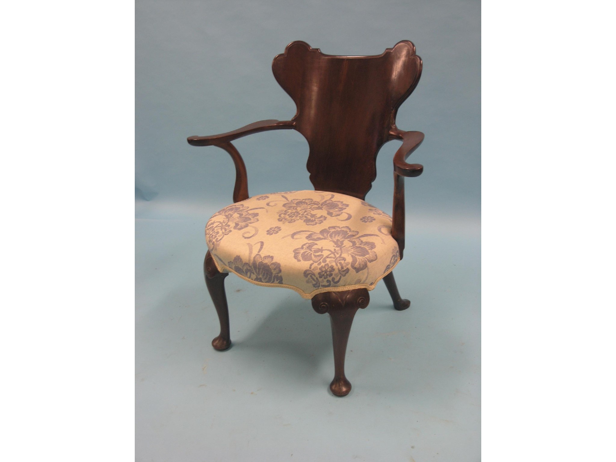 Appraisal: A George I-style mahogany elbow chair shaped back and open