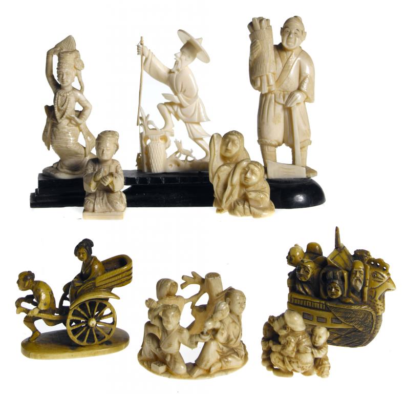 Appraisal: A STAINED IVORY NETSUKE OF THE TAKARABUNE AND THE SHICHIFUKUJIN