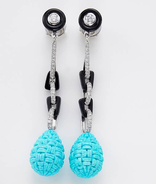 Appraisal: A pair of carved turquoise diamond black onyx and eighteen