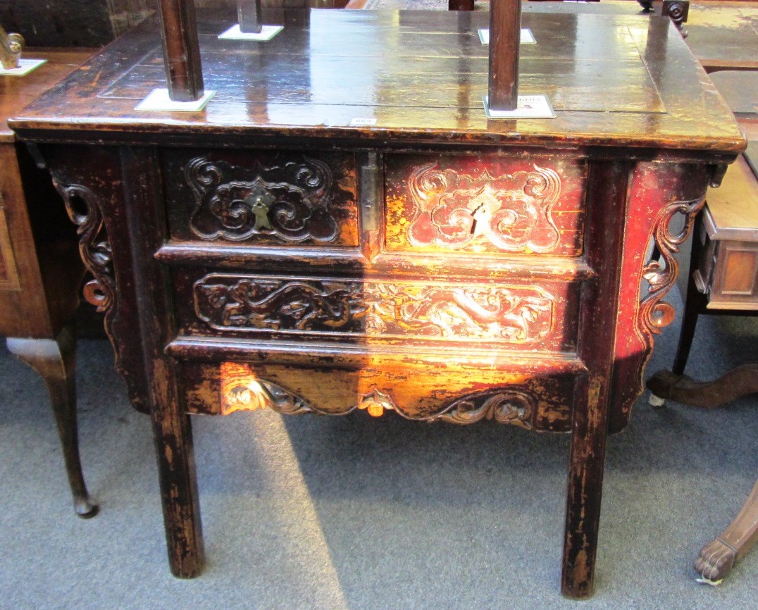 Appraisal: An early th century Chinese red lacquered three drawer side