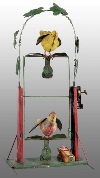 Appraisal: Tin Hand-Painted Double Bird Swing Wind-Up Toy Description German Working