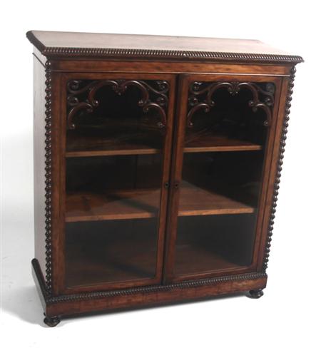 Appraisal: A Victorian mahogany bookcase the gadrooned rectangular top over two