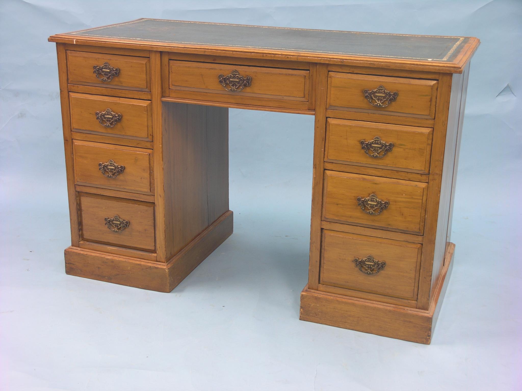 Appraisal: A late Victorian satin-walnut desk inset gilt-tooled leather top above