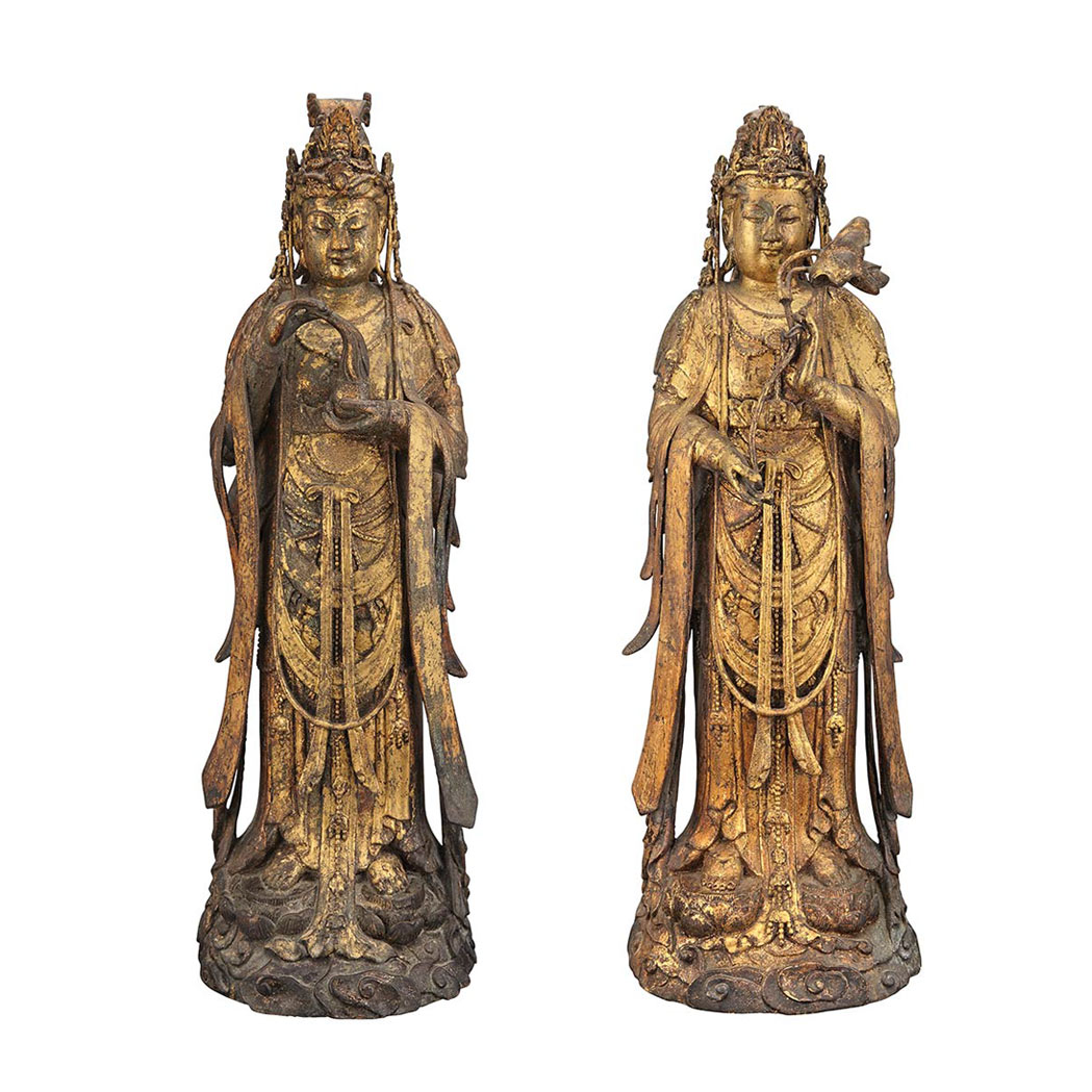 Appraisal: Two Chinese Gilt-Bronze Figures of Guanyin Each standing on a