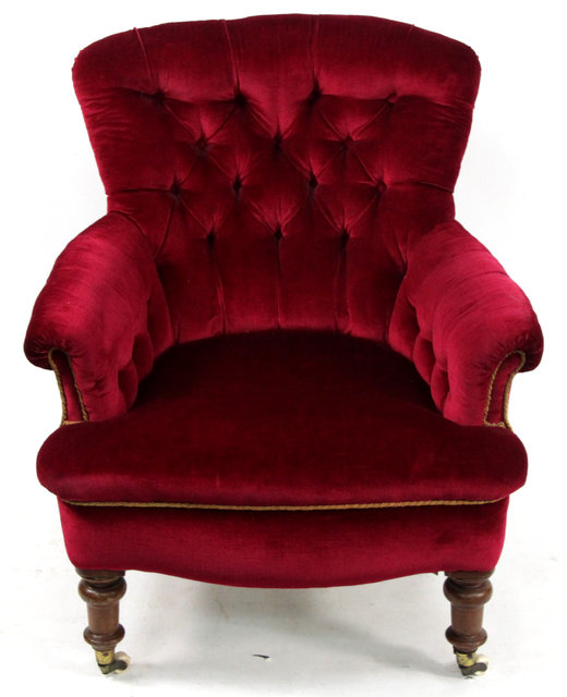 Appraisal: A Victorian button back chair upholstered in crimson material on