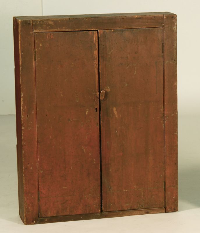 Appraisal: ANTIQUE AMERICAN TWO-DOOR WALL CUPBOARD th CenturyIn red paint Doors