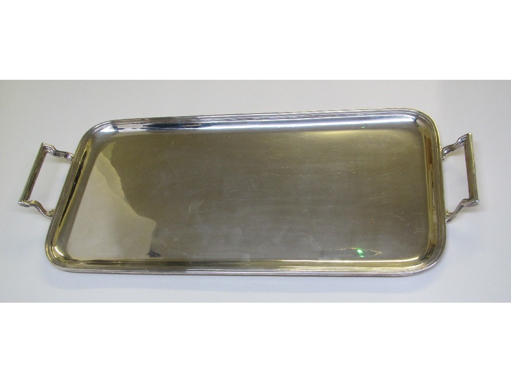 Appraisal: A silver two handled rectangular tea tray with reeded border