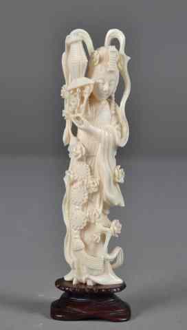 Appraisal: Chinese Carved Ivory Figure Depicting A BeautyFinely carved her holding