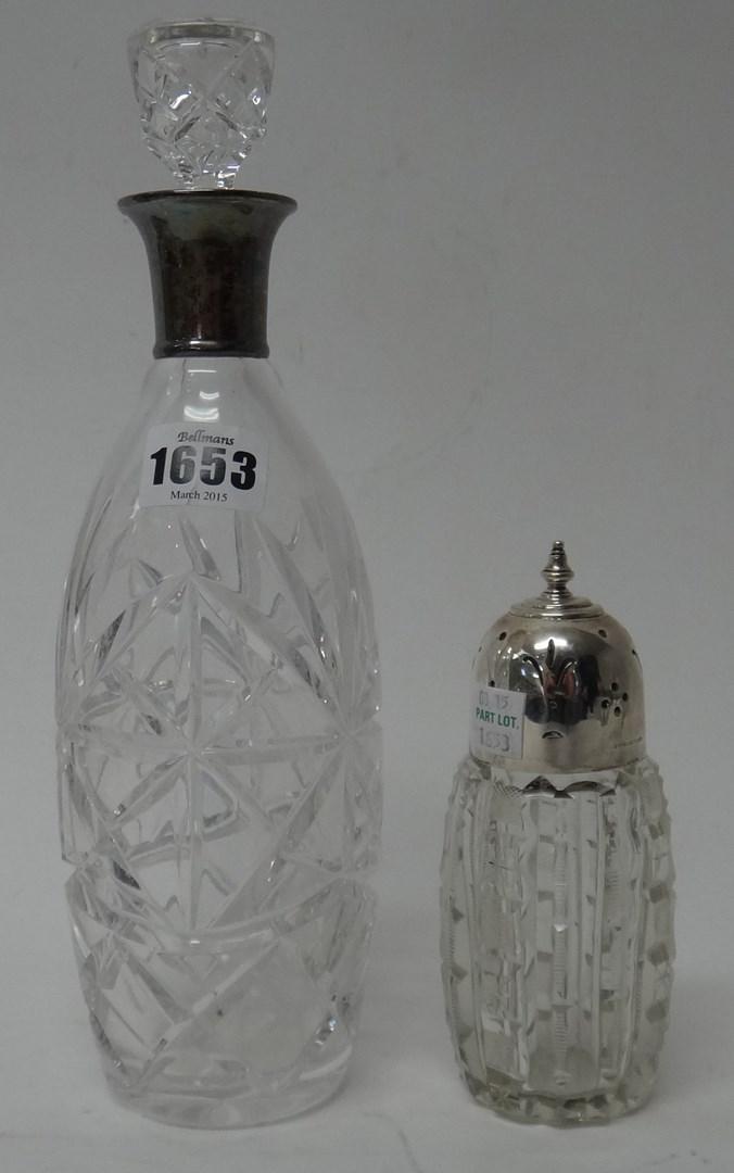 Appraisal: A silver mounted faceted glass decanter and stopper London and