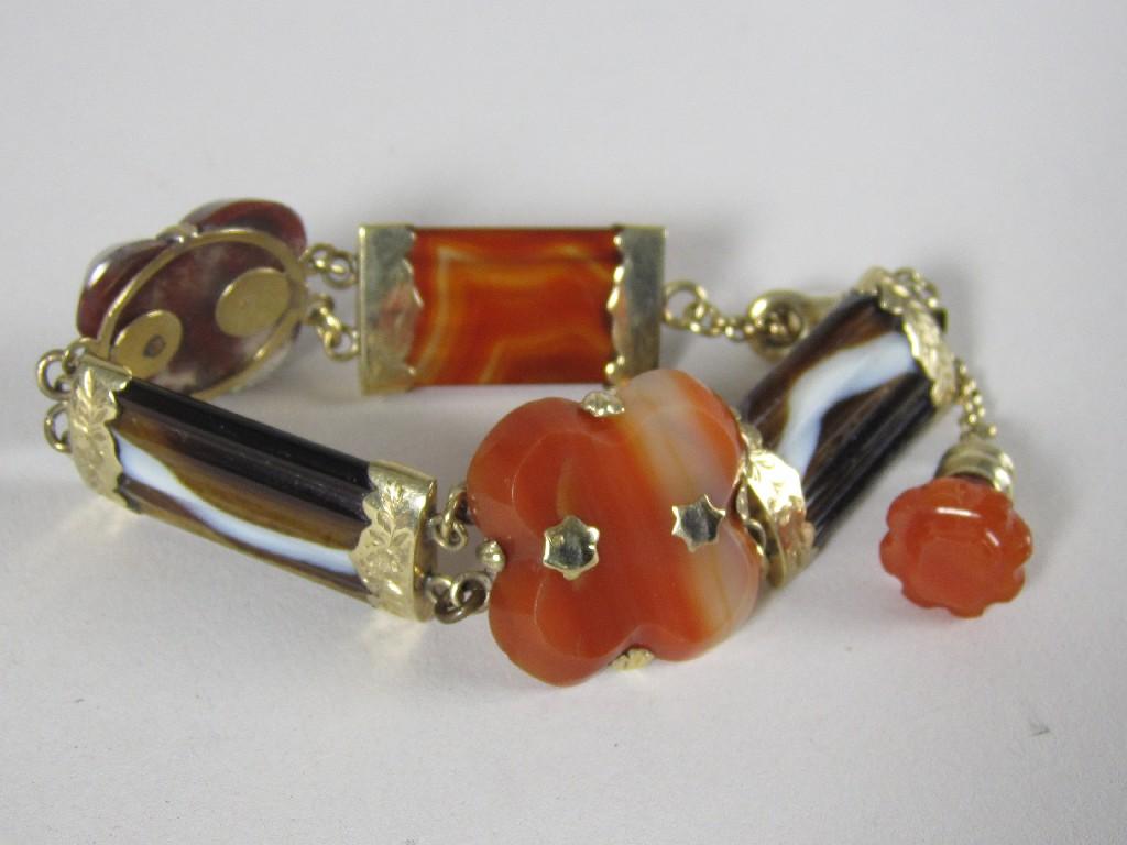 Appraisal: An agate Bracelet with baton and quatrefoil links and engraved