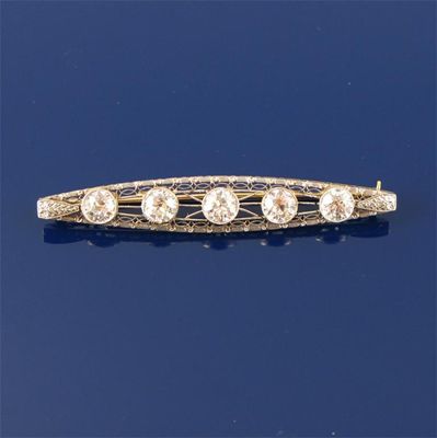 Appraisal: A diamond bar brooch Set with five circular cut diamonds