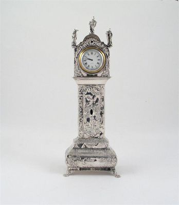 Appraisal: A continental model of a decorative miniature longcase clock with