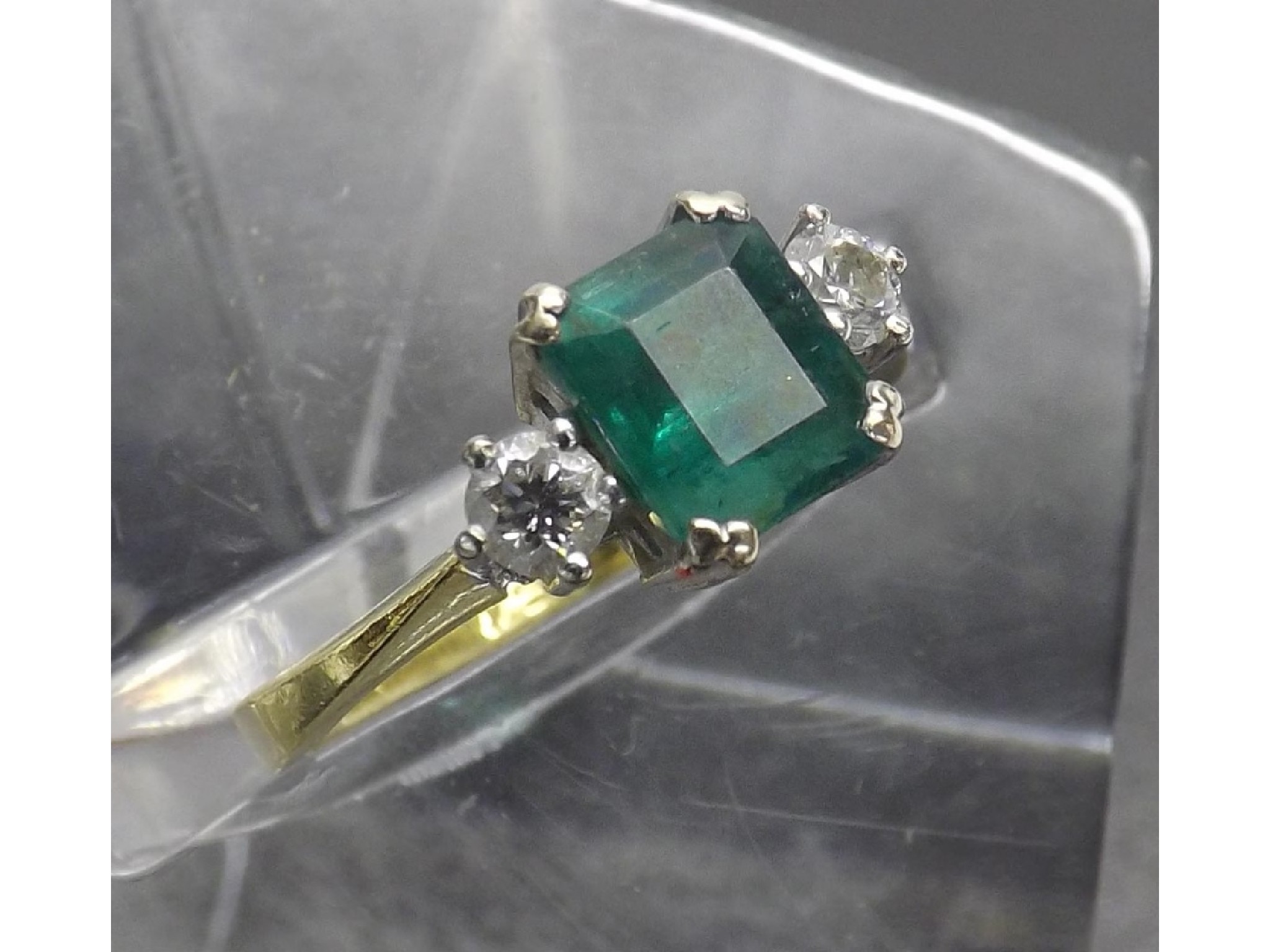 Appraisal: ct emerald and diamond three stone ring round brilliant-cuts ring