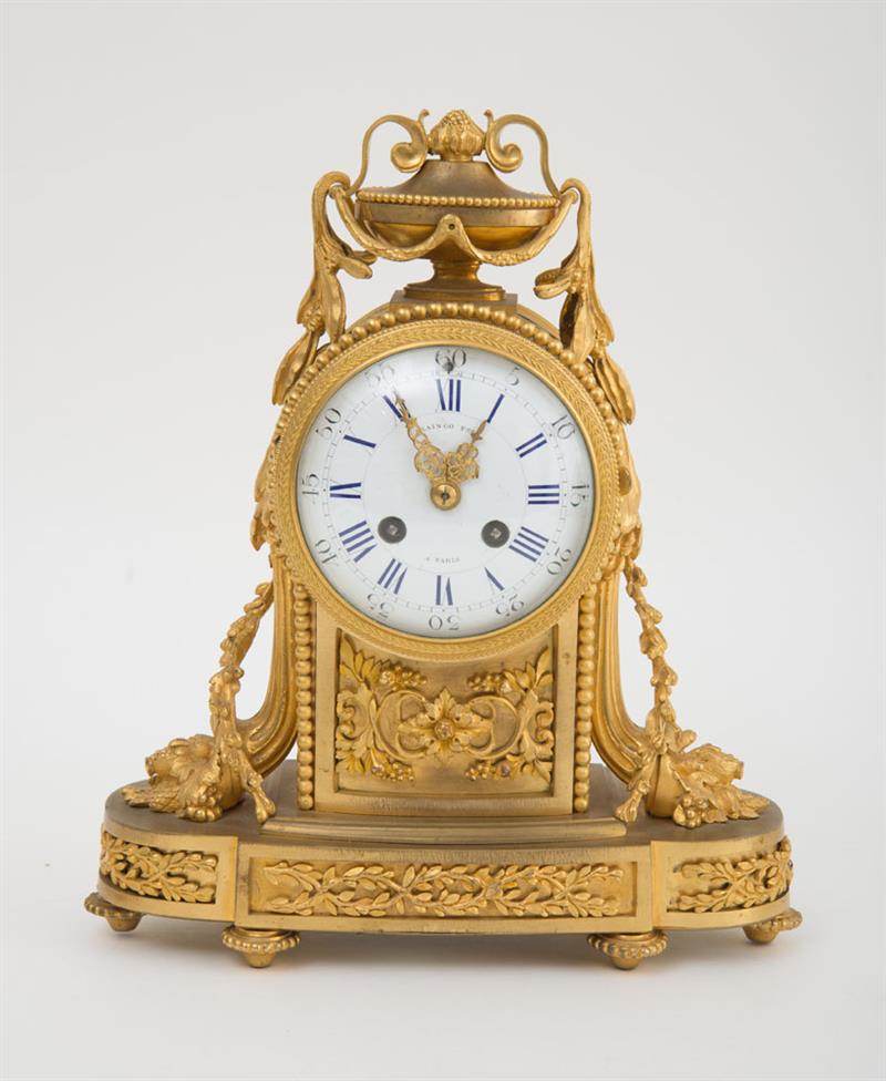 Appraisal: LOUIS XVI STYLE GILT-BRONZE MANTLE CLOCK The in enameled dial