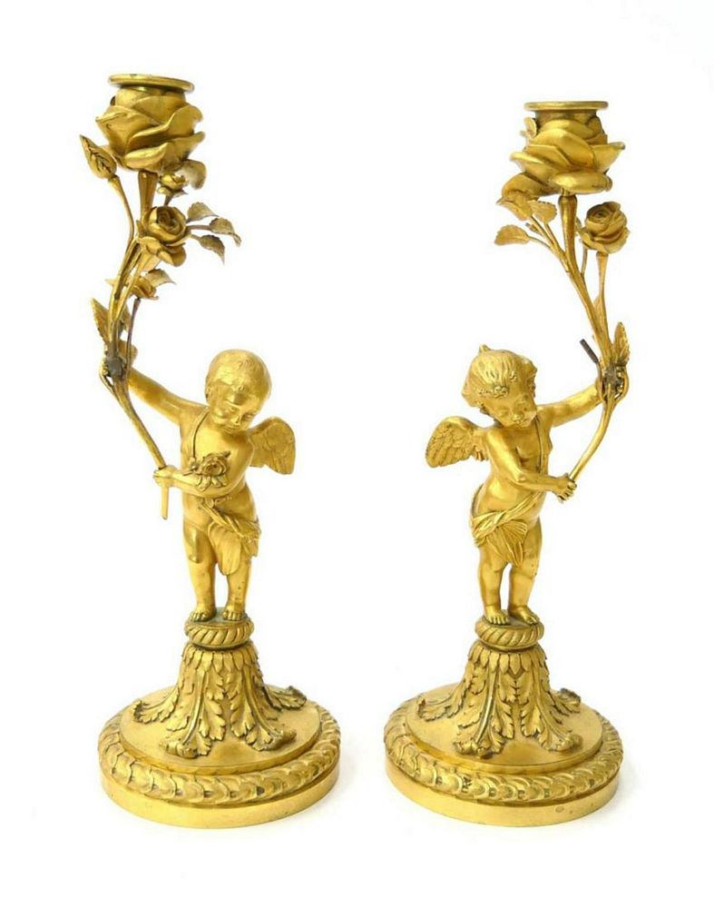 Appraisal: PAIR DORE BRONZE ANTIQUE CHERUB CANDLESTICKS A pair of hallmarked