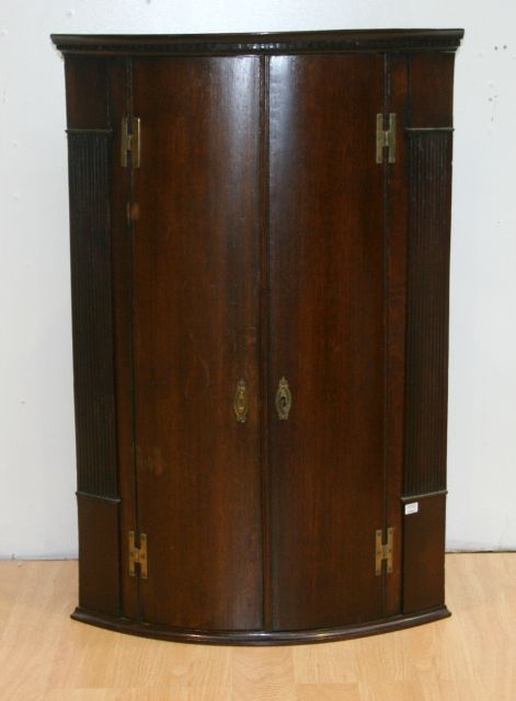 Appraisal: A George III oak corner cupboard cm wide cm deep