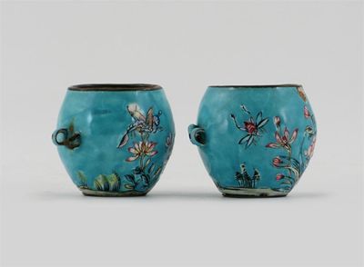 Appraisal: Two Chinese Canton enamel bird feeders painted with flowers and