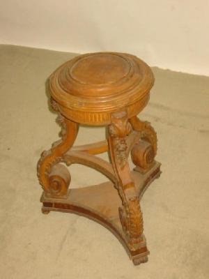 Appraisal: A CARVED LIME WOOD JARDINIERE STAND the moulded circular top