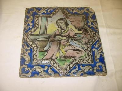 Appraisal: A TURKISH FAIENCE TILE of square form moulded with a