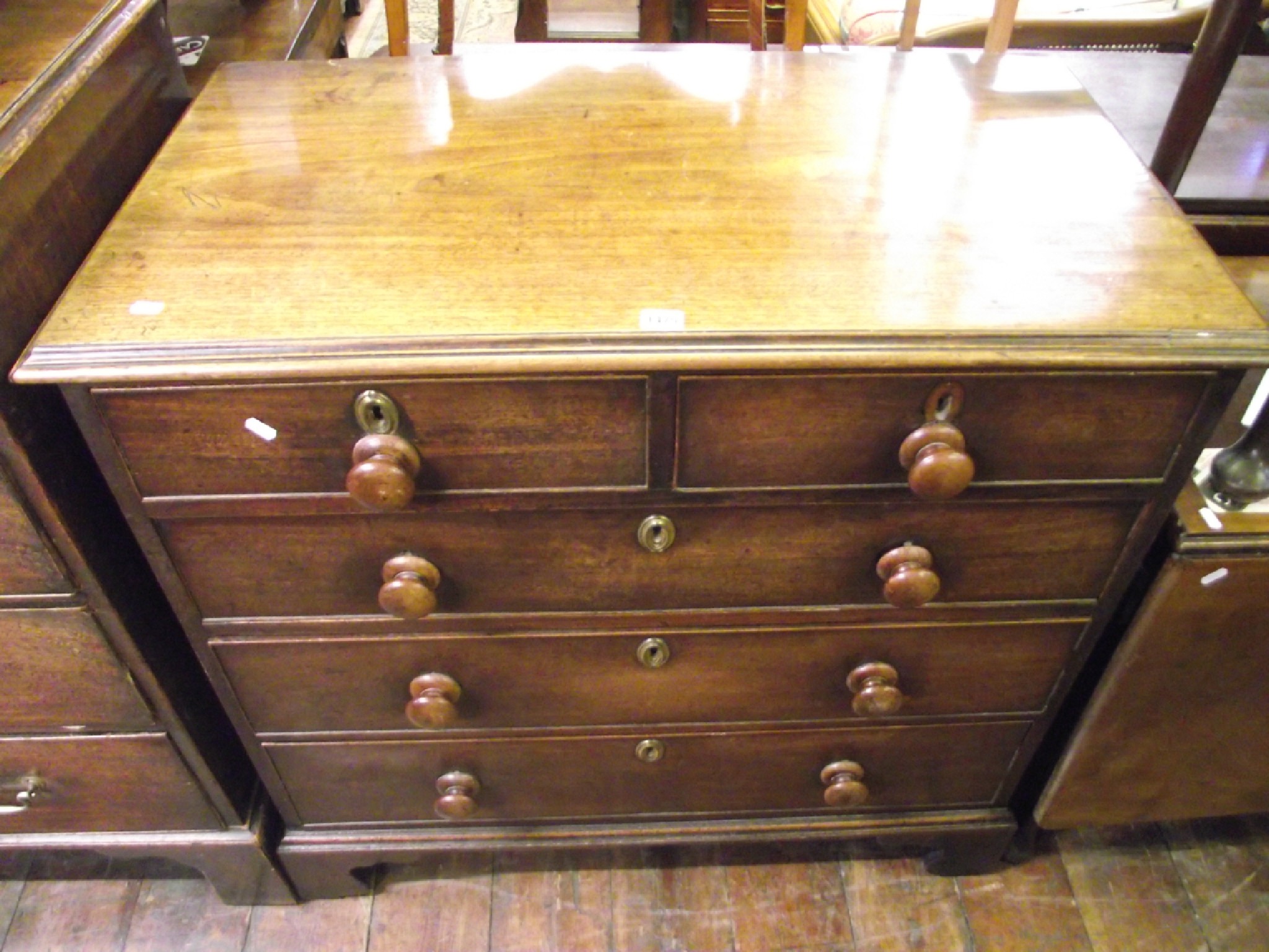 Appraisal: A Georgian mahogany chest of three long and two short