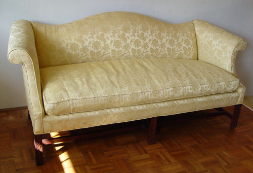 Appraisal: CHINESE CHIPPENDALE STYLE CAMELBACK SOFA Single cushion high scrolled arm