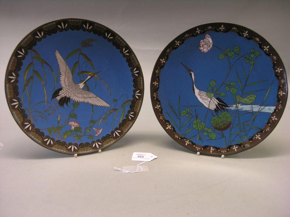 Appraisal: Two Japanese cloisonne enamelled wall plates decorated with herons against