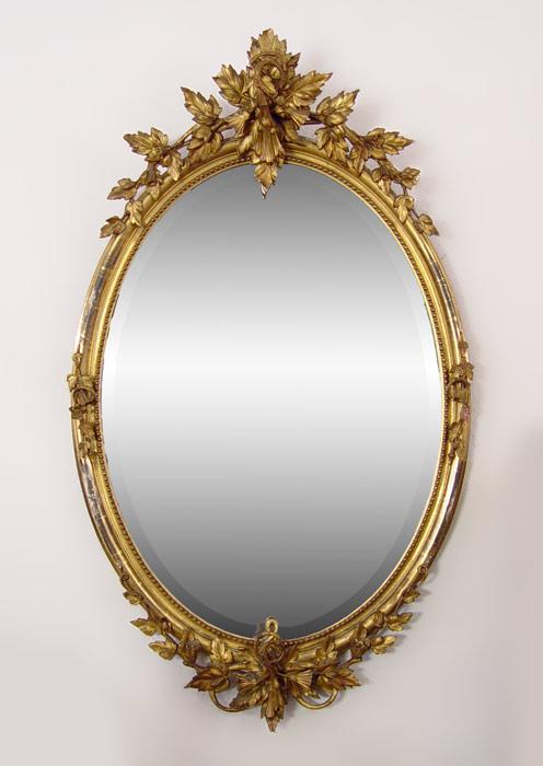 Appraisal: TH C GILT WOOD PARLOR MIRROR Oval beveled looking glass