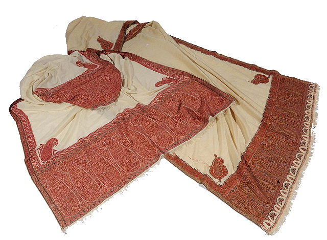 Appraisal: A KASHMIR IVORY GROUND SHAWL woven cashmere with polychrome border