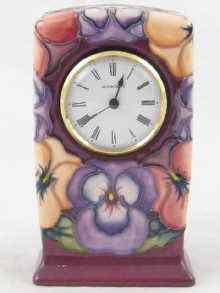 Appraisal: Moorcroft A ceramic cased clock pansy pattern cm high WM