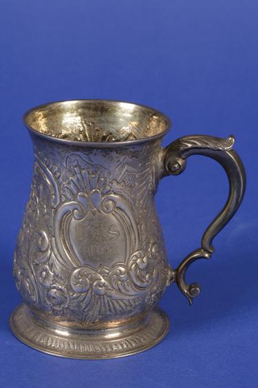 Appraisal: A GEORGE II MUG of baluster form with a leaf-capped