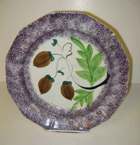 Appraisal: ENGLISH SPATTERWARE Two paneled spatter plates one purple the other