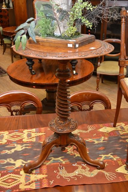 Appraisal: A VICTORIAN HEAVILY CARVED BURR WALNUT WINE TABLE A VICTORIAN