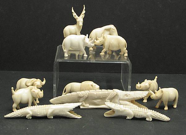 Appraisal: An assembled group of thirteen African carved ivory animals th