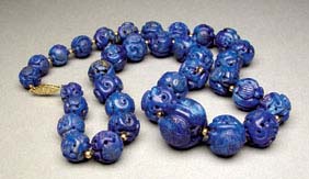 Appraisal: CARVED LAPIS LAZULI BEADS Good strand of old Chinese fully