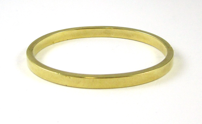 Appraisal: FOURTEEN KARAT YELLOW GOLD BANGLE The oval hinged bangle weighs