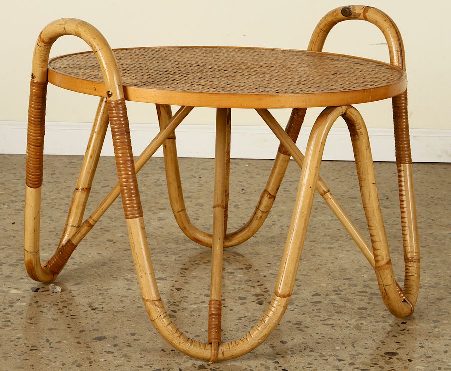 Appraisal: FRENCH RATTAN COFFEE TABLE JEAN ROYERE A circular French rattan