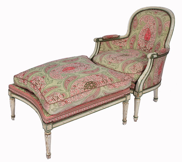 Appraisal: AN EARLY TH CENTURY FRENCH UPHOLSTERED ARMCHAIR with fluted legs