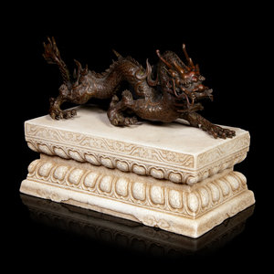 Appraisal: A Large Chinese Bronze Dragon and Stone Base the sinuous