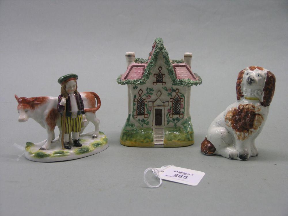 Appraisal: A Victorian Staffordshire pottery cottage model in together with a