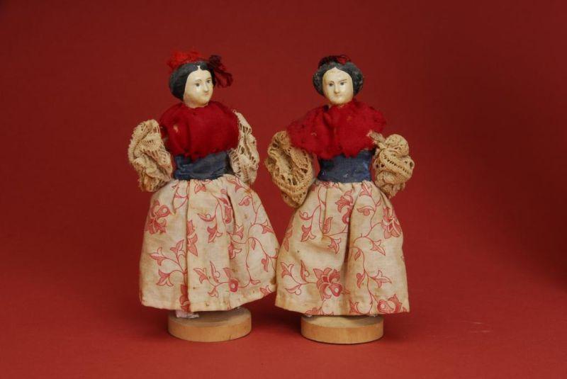 Appraisal: Pair of Small Papier Mache Dolls on Wooden Bases Germany