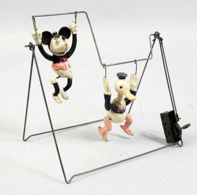 Appraisal: Celluloid Minnie Donald Acrobat Wind-Up Toy Description Japanese Circa s