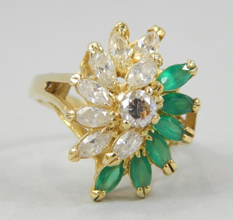 Appraisal: A ladies dress ring with green marquise stones and diamond