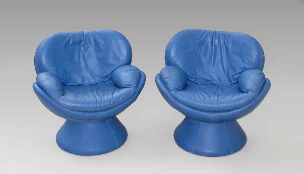 Appraisal: PAIR BLUE LEATHER CHAIRS Fit like a glove degree swivel