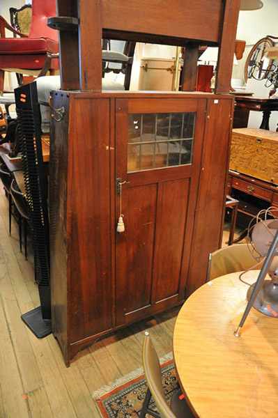 Appraisal: AN ARTS AND DRAFTS HALL CUPBOARD WITH UMBRELLA STAND