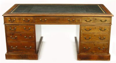 Appraisal: A mahogany pedestal desk the inset leather top with gilt