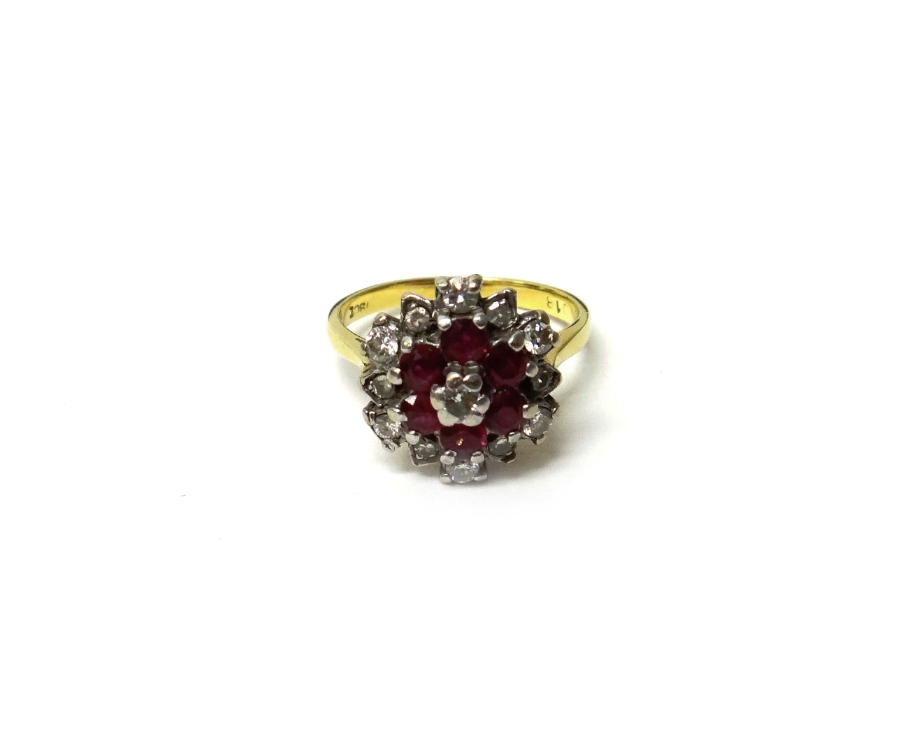 Appraisal: A gold diamond and ruby cluster ring claw set with