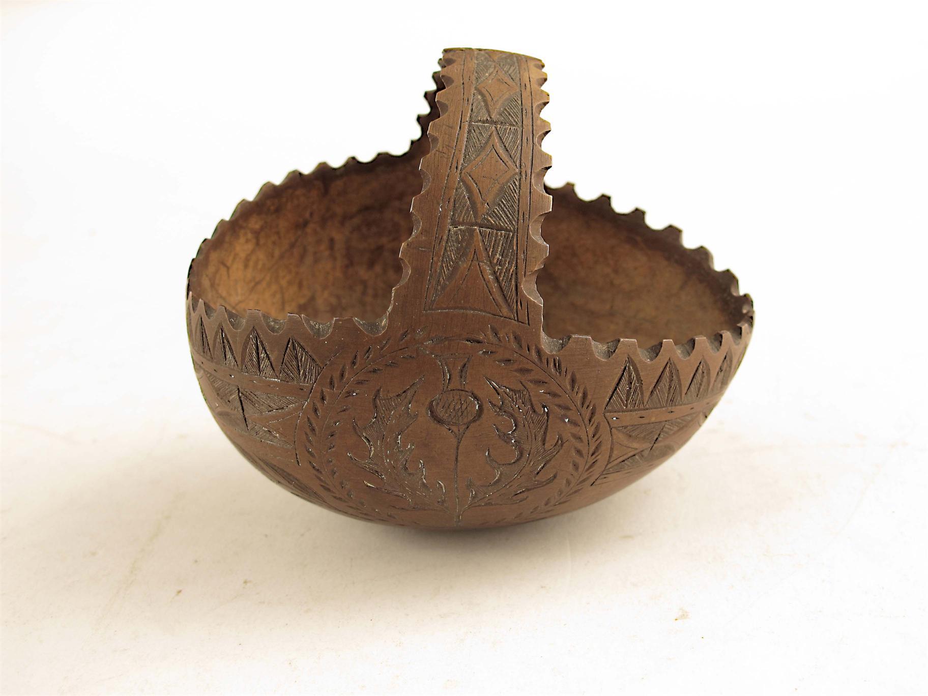 Appraisal: A sailors carved coconut in the form of a basket