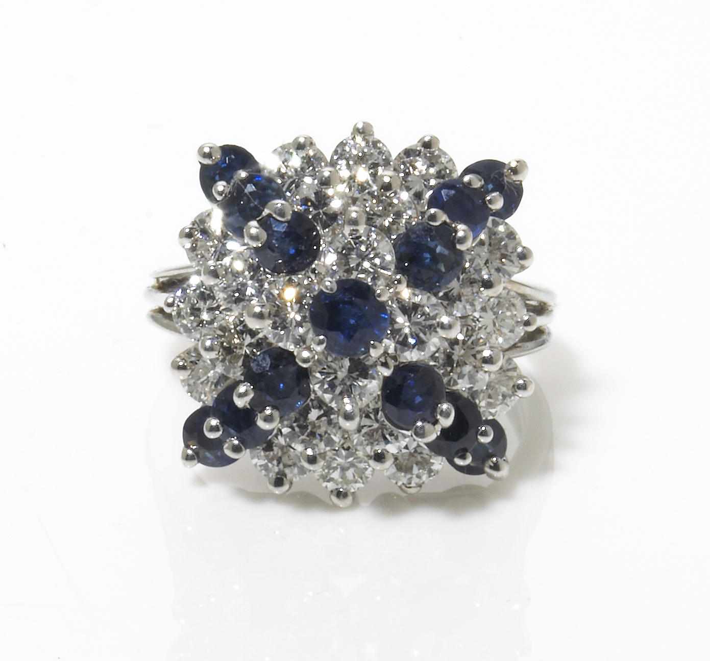 Appraisal: A sapphire and diamond ring estimated total diamond weight carats