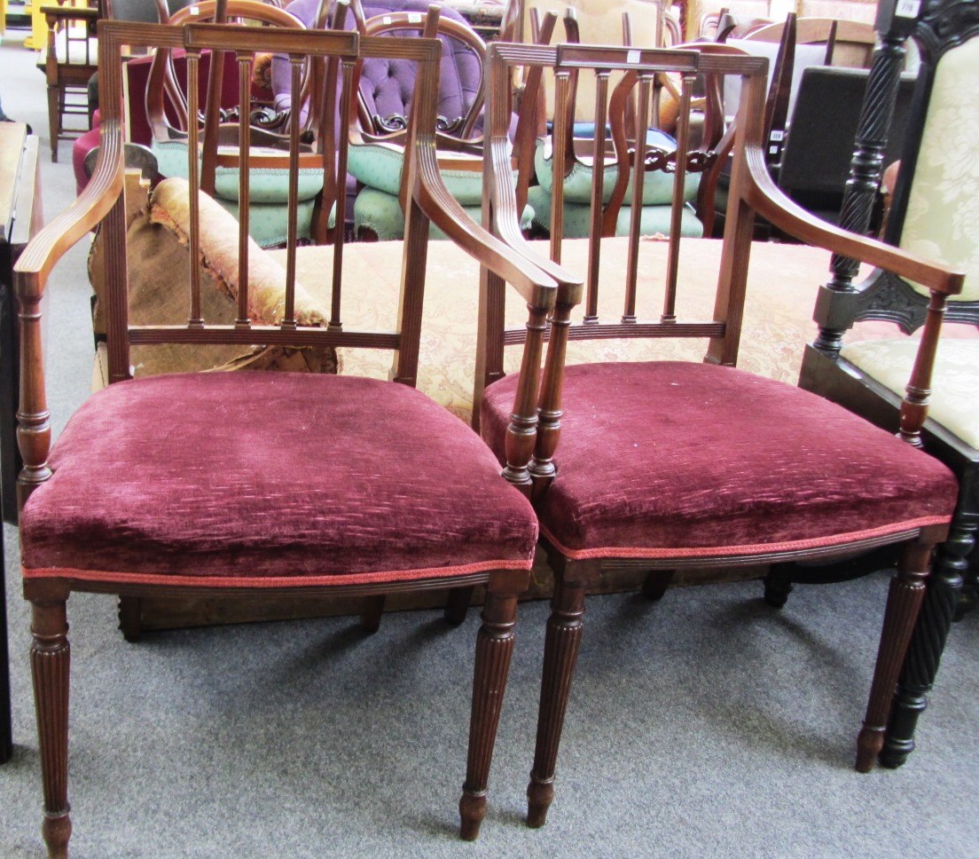 Appraisal: A pair of Regency mahogany carver chairs on tapering fluted